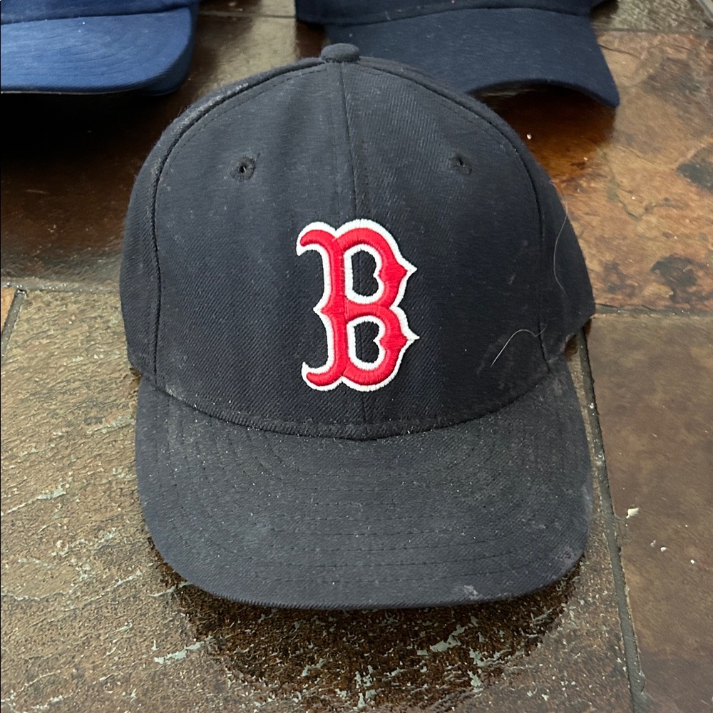 Boston Red Sox baseball hat.